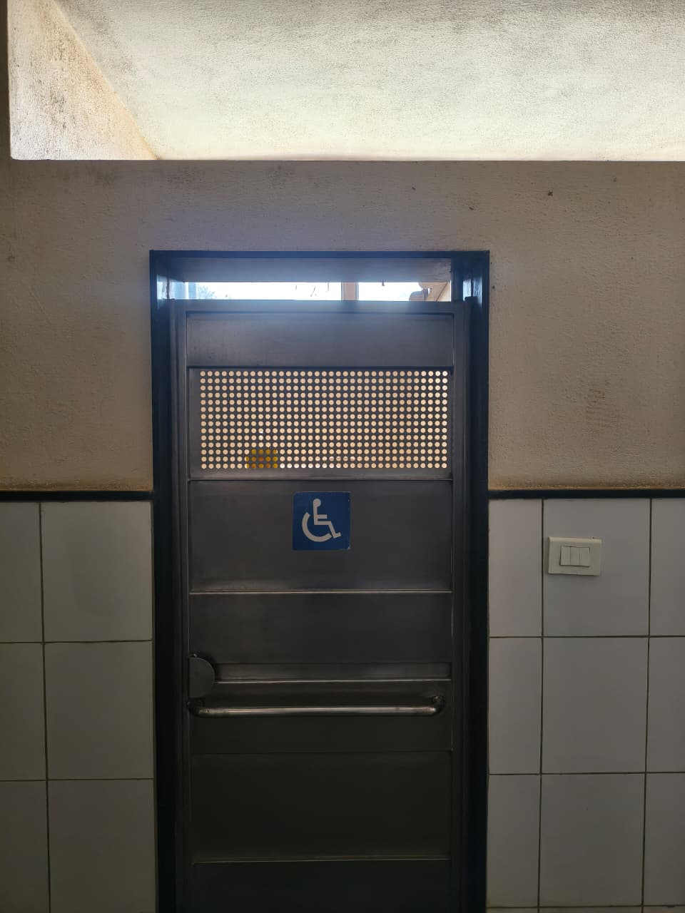 Wheelchair-accessible ramp with handrails